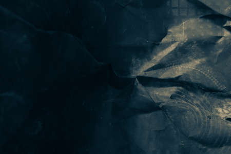 black creased crumpled paper background grunge texture backdropの写真素材