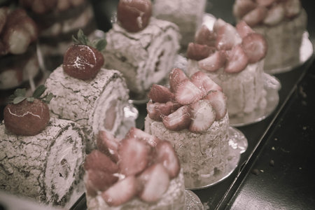 Board with delicious cake on table