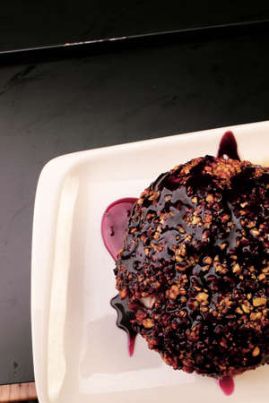 Board with delicious cake on tableの写真素材