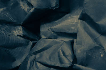 black creased crumpled paper background grunge texture backdropの写真素材
