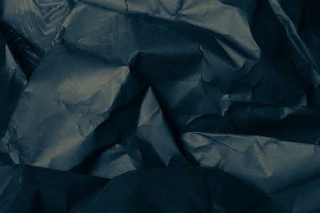 black creased crumpled paper background grunge texture backdropの写真素材