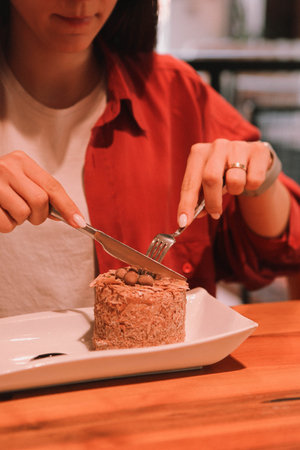 Board with delicious cake on table
