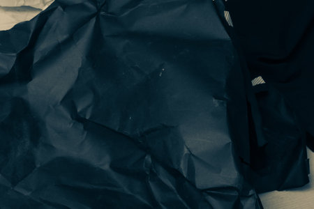 black creased crumpled paper background grunge texture backdrop