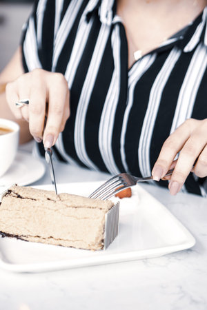 Board with delicious cake on table
