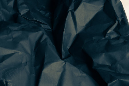 black creased crumpled paper background grunge texture backdrop