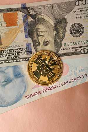 Turkish lira banknotes, US Dollars and bitcoin coin
