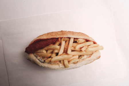 Delicious sandwich with french fries, breakfast meal.