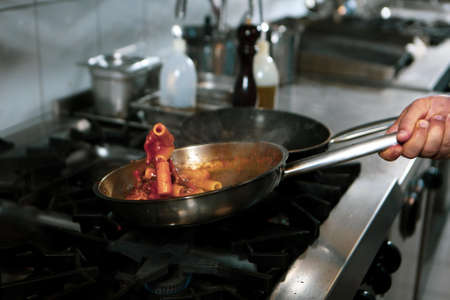 pot with cake on the fire stove cookingの写真素材