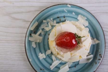 Board with delicious cake on tableの写真素材