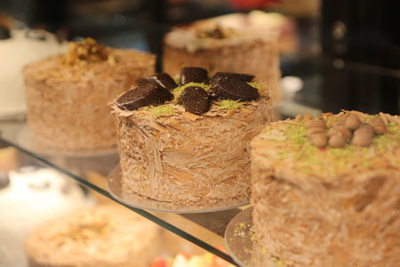 Board with delicious cake on table