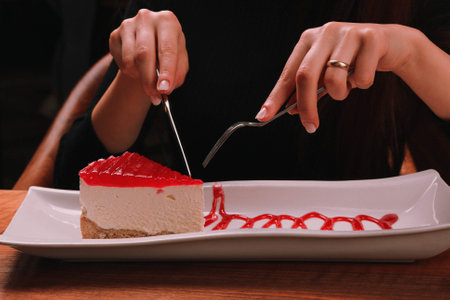 Board with delicious cake on tableの写真素材