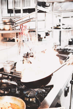 pot with cake on the fire stove cookingの写真素材