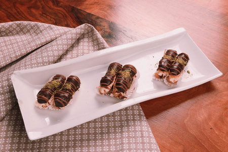 Board with delicious cake on table