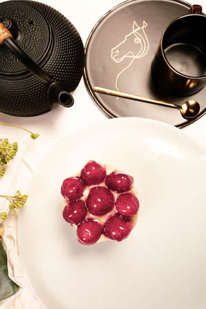Board with delicious cake on tableの写真素材