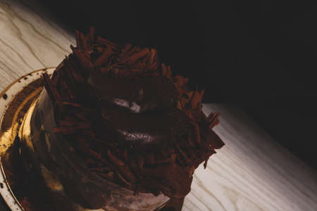 Board with delicious cake on tableの写真素材