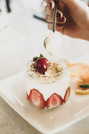 Very delicious dessert in jars, sweet and cakes in jarsの写真素材