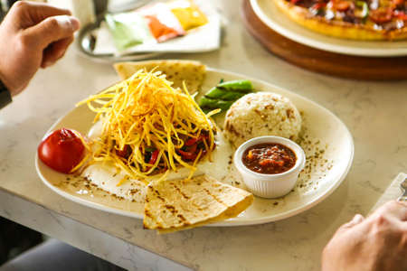 Tasty chicken meal on the tableの写真素材