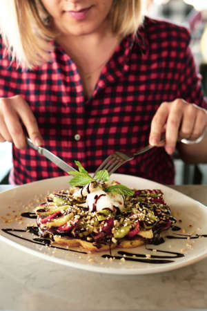 Delicious waffles with chocolate sauceの写真素材