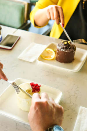 Board with delicious cake on tableの写真素材