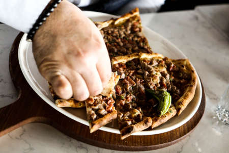 Traditional turkish baked dish pide. Turkish pizza pide, Middle eastern appetizers. Turkish cuisine. Pita with meat fillingの写真素材