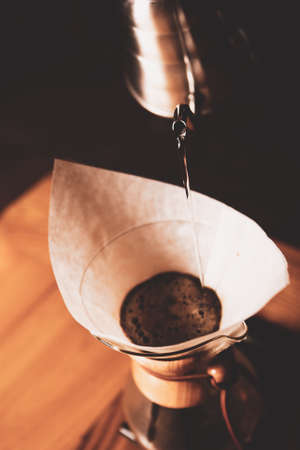 barista brewing coffee in the coffee roomの写真素材
