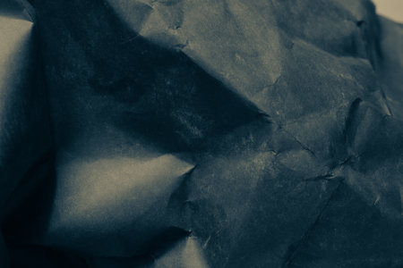 black creased crumpled paper background grunge texture backdropの写真素材