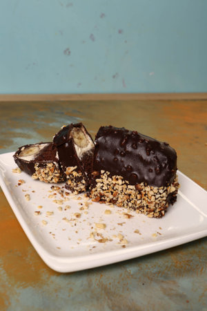 Board with delicious cake on table