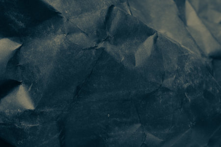 black creased crumpled paper background grunge texture backdropの写真素材