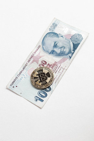 Turkish lira banknotes and bitcoin coinの写真素材