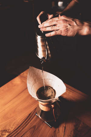 barista brewing coffee in the coffee roomの写真素材