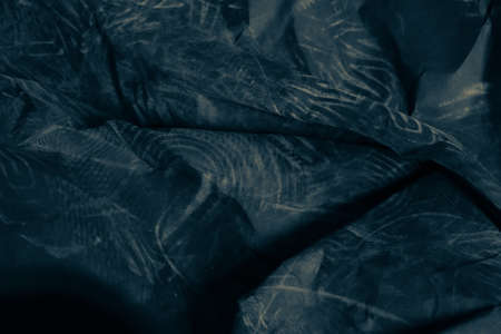 black creased crumpled paper background grunge texture backdropの写真素材