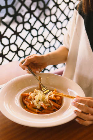 Tasty appetizing classic Italian pasta with a delicious sauce.の写真素材