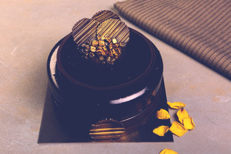 Board with delicious cake on table