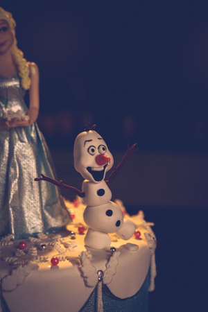 Board with delicious cake on tableの写真素材