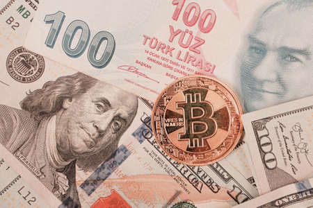 Turkish lira banknotes, US Dollars and bitcoin coinの写真素材