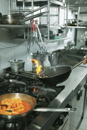 pot with cake on the fire stove cookingの写真素材