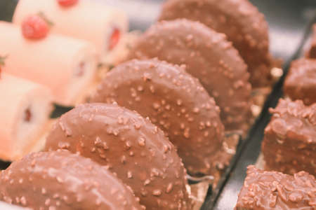 Board with delicious cake on tableの写真素材