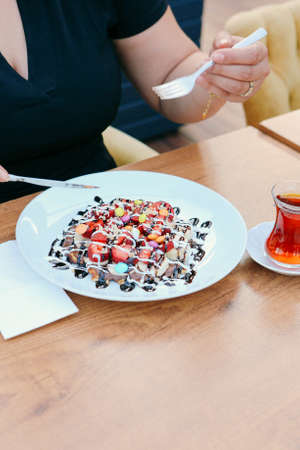 Delicious waffles with chocolate sauceの写真素材