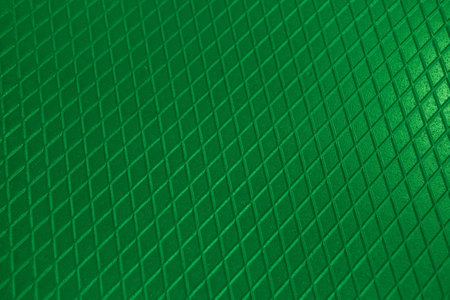 Green metal texture steel background. Perforated sheet metal.