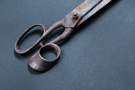 Rusty and old scissors on white background