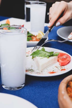 Turkish and Greek Traditional Dinning Table with Special Alcohol Drink Raki. Ouzo and Turkish Raki is a dry anise flavored aperitif that is widely consumed in Turkey, Greece, Cyprus and Lebanonの写真素材