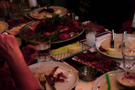 Turkish and Greek Traditional Dinning Table with Special Alcohol Drink Raki. Ouzo and Turkish Raki is a dry anise flavored aperitif that is widely consumed in Turkey, Greece, Cyprus and Lebanonの写真素材