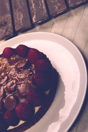 Board with delicious cake on table
