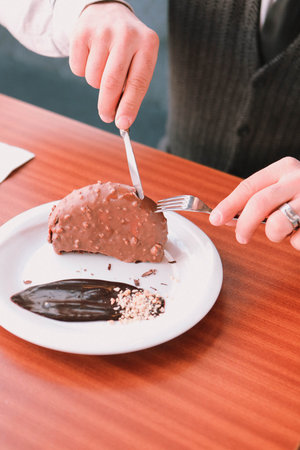 Board with delicious cake on table