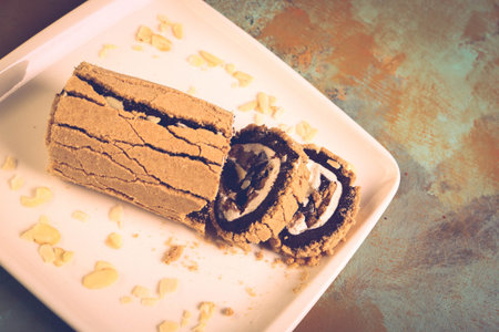 Board with delicious cake on table