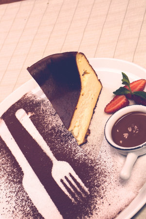 Board with delicious cake on table