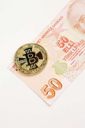 Turkish lira banknotes and bitcoin coinの写真素材