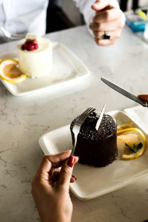 Board with delicious cake on tableの写真素材