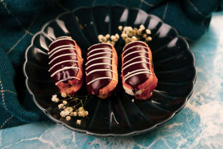 Board with delicious cake on tableの写真素材