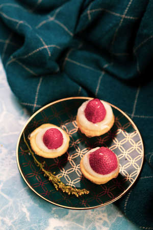 Board with delicious cake on tableの写真素材